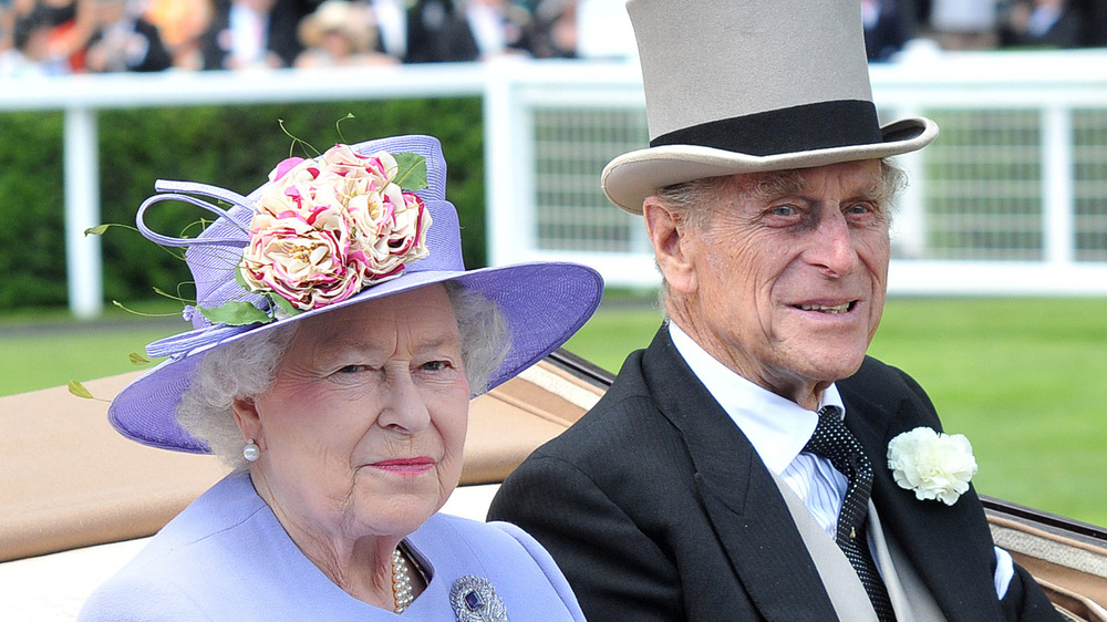 Queen Elizabeth and Prince Philip in a car