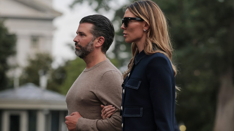 Donald Trump Jr. and Bettina Anderson walk on the South Lawn.