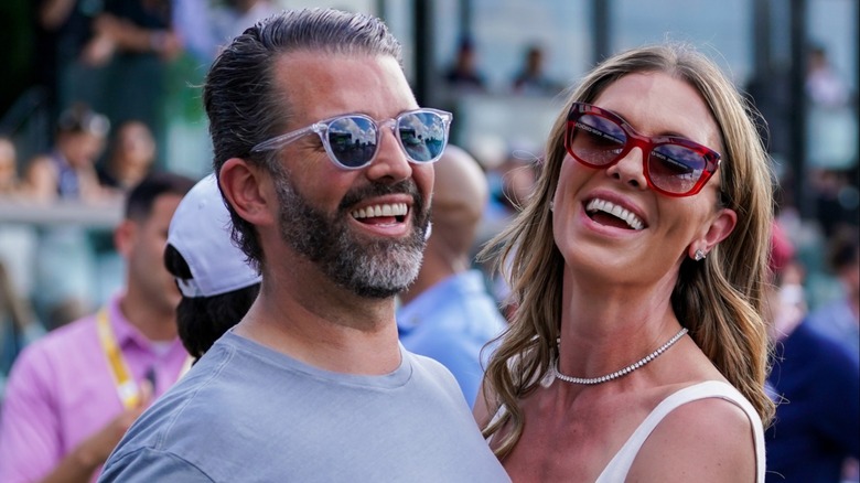 Donald Trump Jr. and Bettina Anderson laughing together.