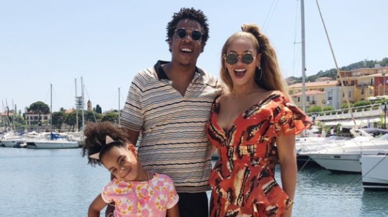 Blue Ivy, Jay-Z, and Beyoncé smiling on vacation