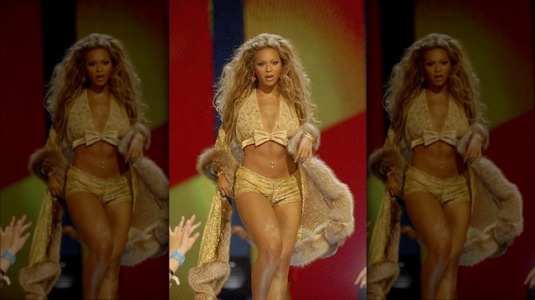 Beyonce wearing fur and walking