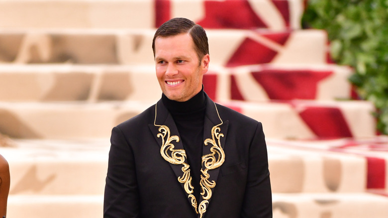 Tom Brady smiling at the Met Gala
