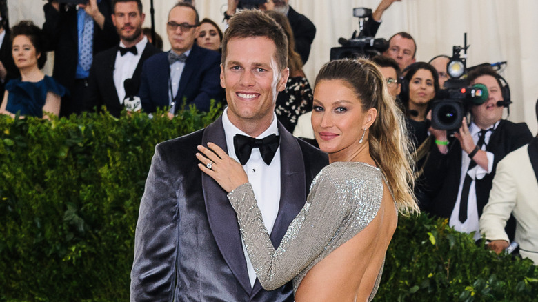 Tom Brady and Gisele Bündchen posing together on red carpet