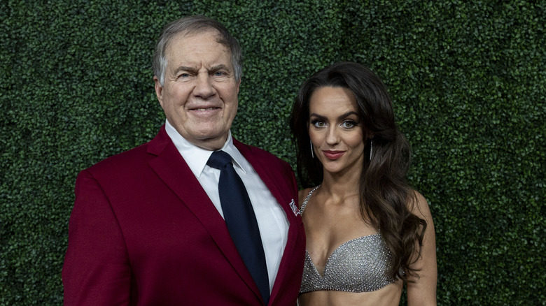 Bill Belichick and Jordon Hudson pose in February 2025 event