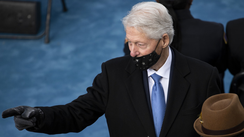 Bill Clinton points at someone during Joe Biden's inauguration in 2021