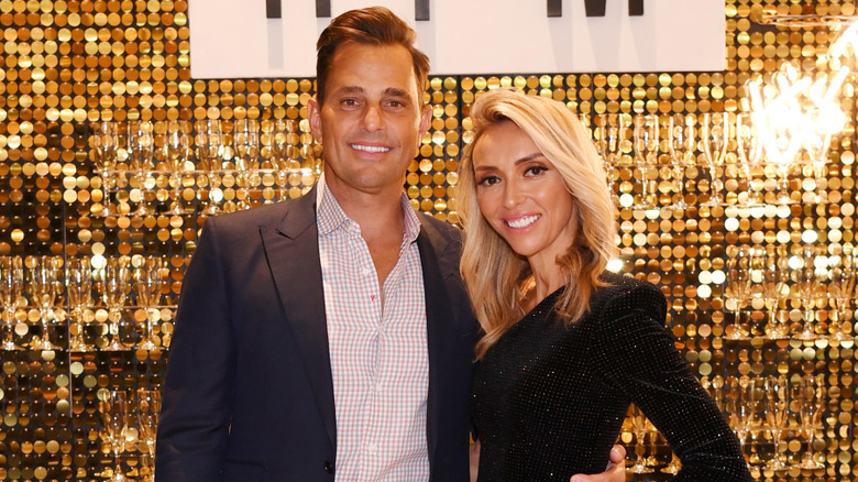 Giuliana and Bill Rancic posing at one of their restaurants.