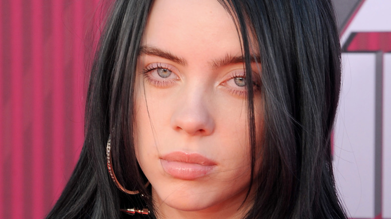 Billie Eilish looking serious at an event