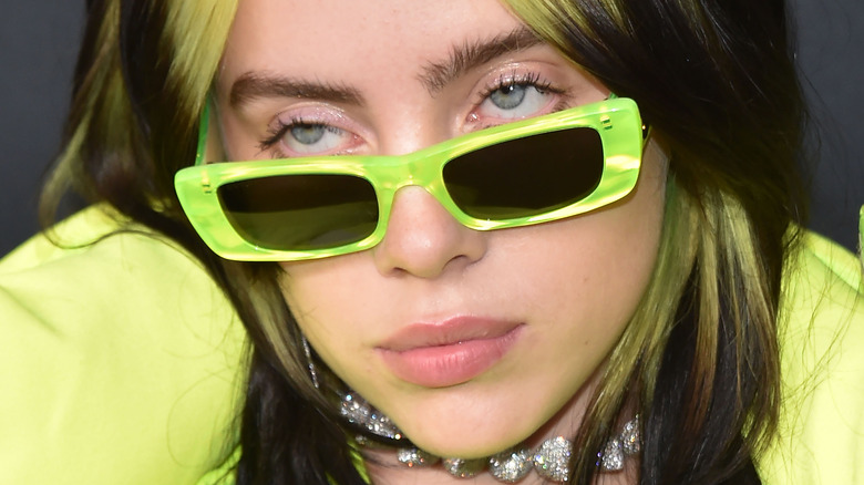 Billie Eilish posing in sunglasses