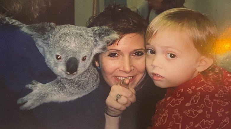 Young Billie Lourd with Carrie Fisher and a koala