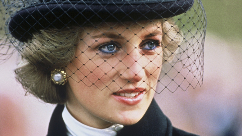 Princess Diana wearing black hat