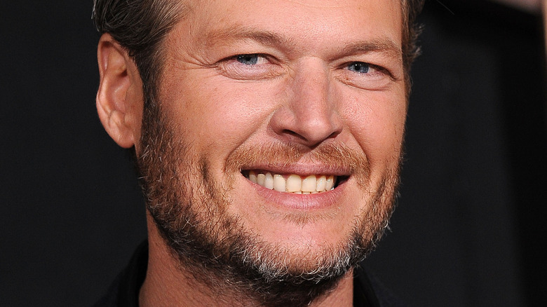 Blake Shelton smiles at event