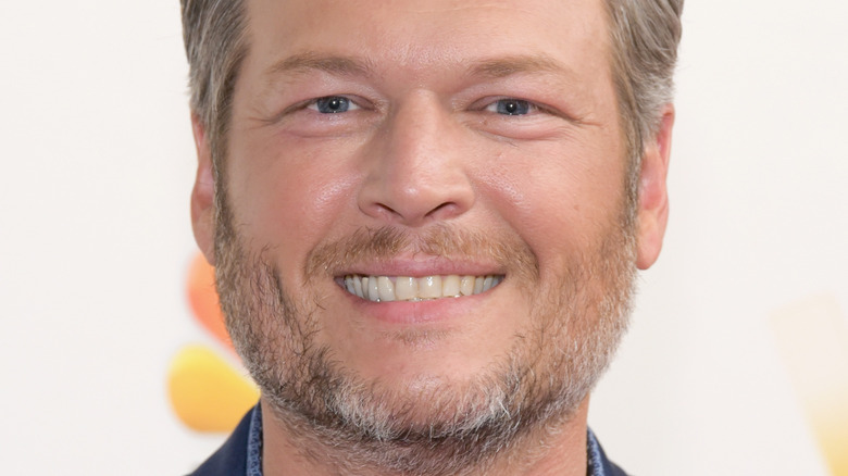 Blake Shelton smiling with scruff