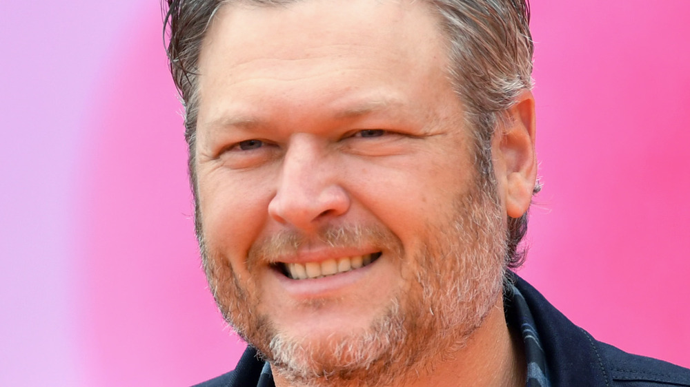 Blake Shelton smiling on the red carpet