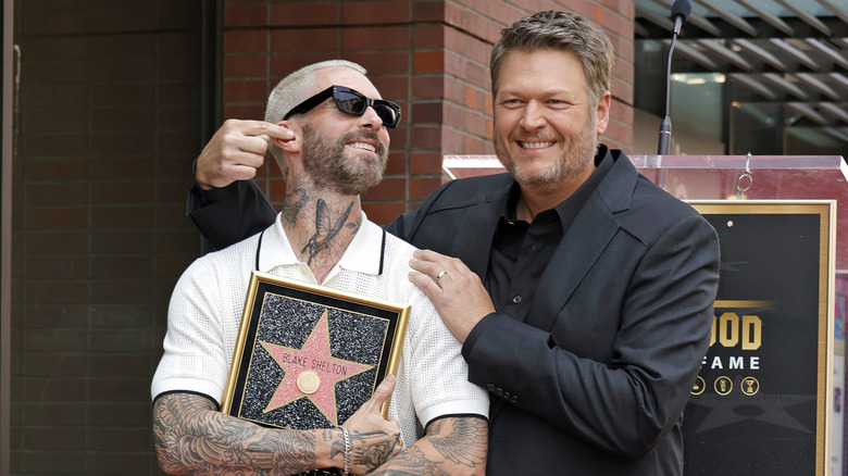 Adam Levine and Blake Shelton posing