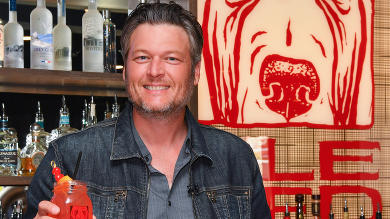 Blake Shelton holding a drink