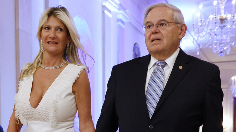 Nadine Menendez and Bob Menendez walk hand in hand