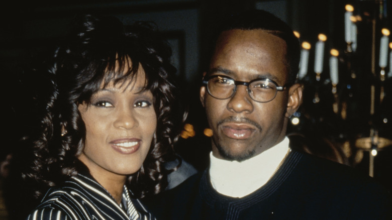 Whitney Houston and Bobby Brown posing