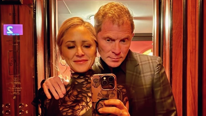 Brooke Williamson and Bobby Flay pose for a mirror selfie.