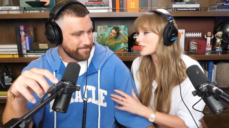 Travis Kelce and Taylor Swift filming a podcast