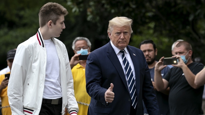 Barron Trump looking at Donald Trump