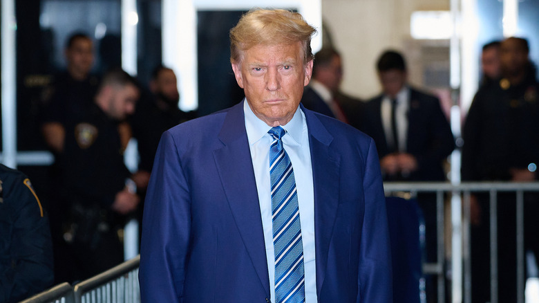 Donald Trump standing in front of press