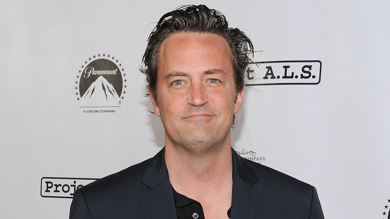 Matthew Perry smiling in close-up