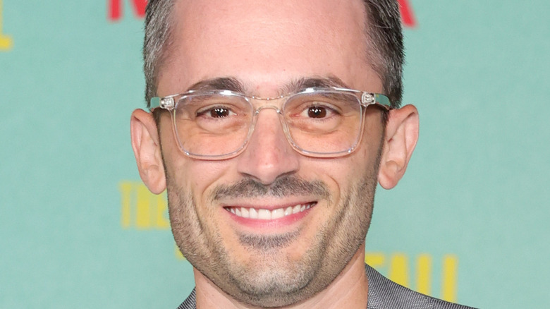 Brad Lambert smiling wearing glasses