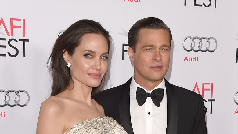 Angelina Jolie and Brad Pitt pose 