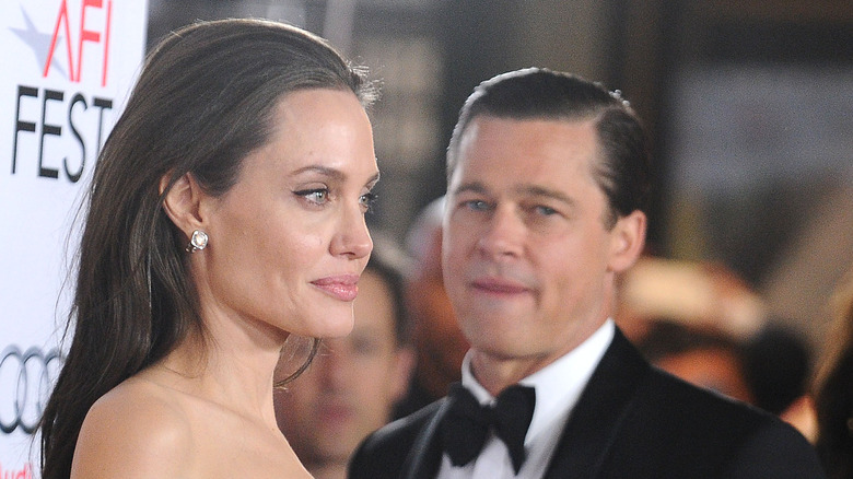 Brad Pitt staring at Angelina Jolie