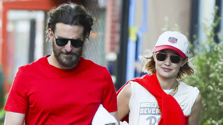Bradley Cooper and Gigi Hadid wearing red and white outfits