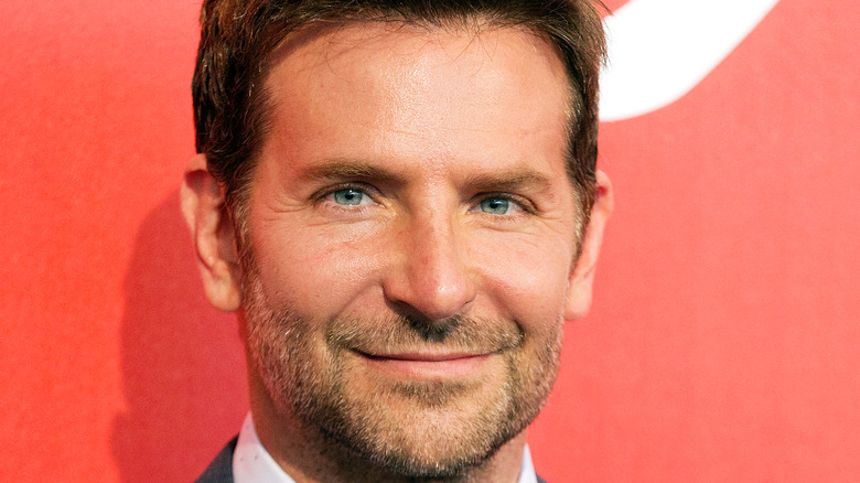 Bradley Cooper smiles at an event