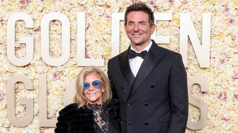 Bradley Cooper, Gloria Campano posing