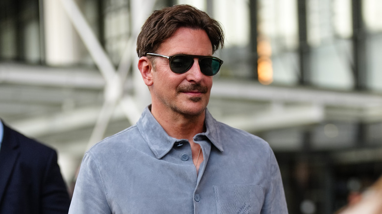 Bradley Cooper sporting a mustache and shades