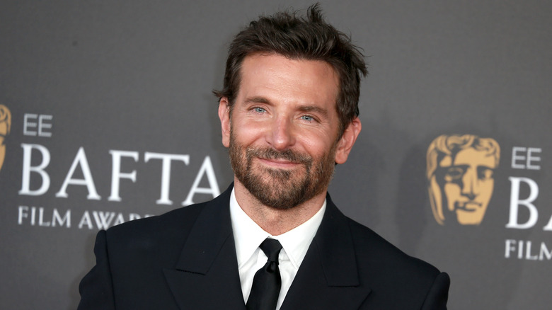 Bradley Cooper smirking on red carpet