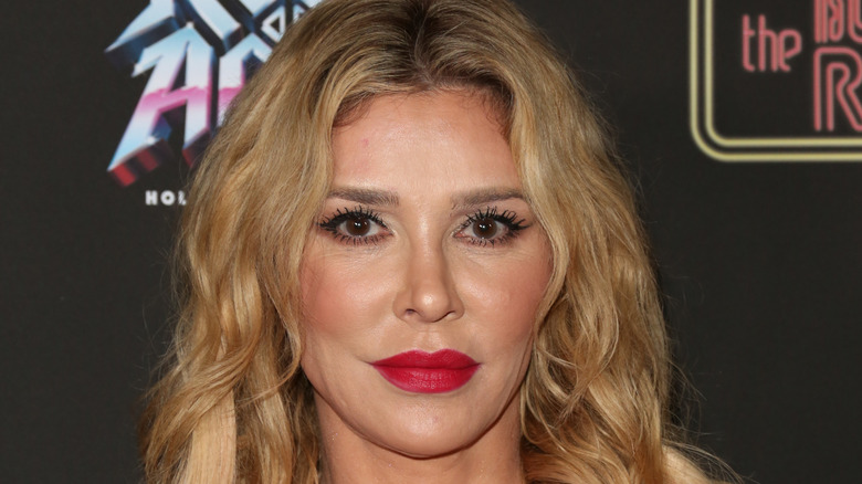 Brandi Glanville smiling curled hair