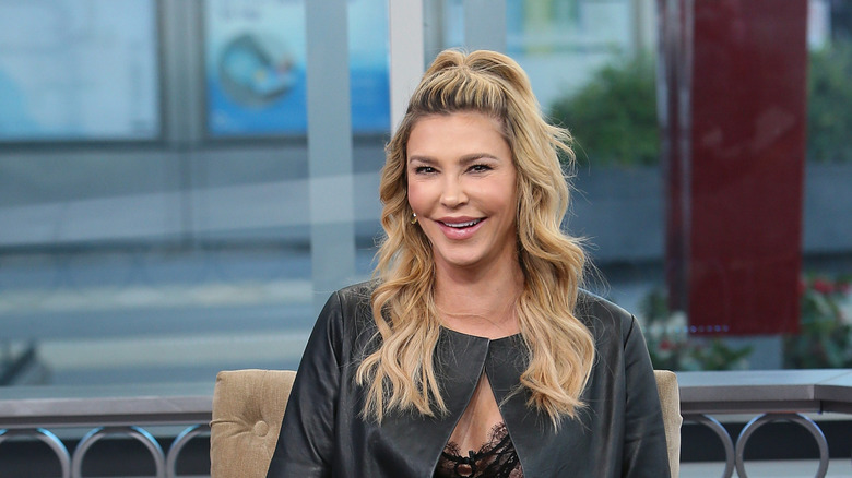 Brandi Glanville laughing, tousled hair
