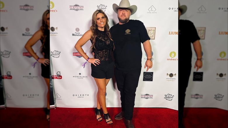 Wearing a see-through black outfit, Brandi Passante strikes a pose next to chef Antonio Nuñez.