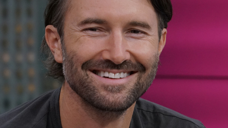 Brandon Jenner smiling salt and pepper beard