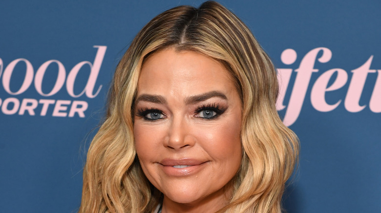 Denise Richards smiles wavy hair