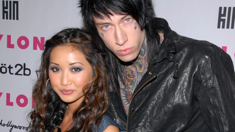 Brenda Song and Trace Cyrus embracing