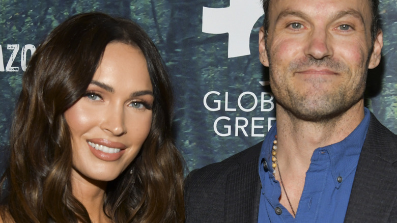 Brian Austin Green and Megan Fox smiling on a red carpet