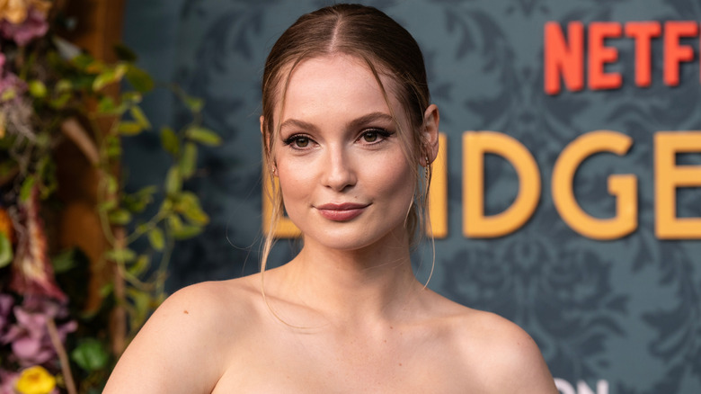 Sporting flawless makeup, Hannah Dodd gazes away from the camera at a Netflix event.
