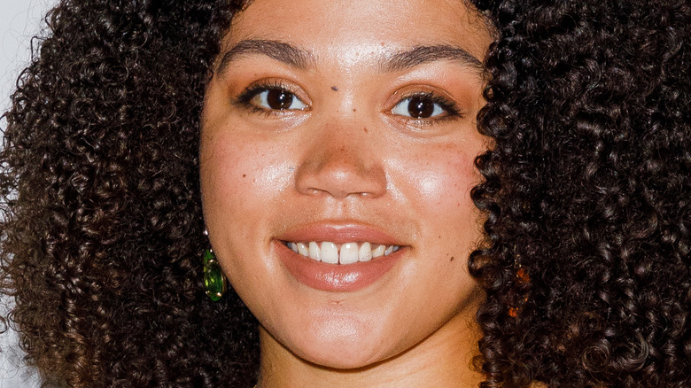 Ruby Barker smiling with big hair