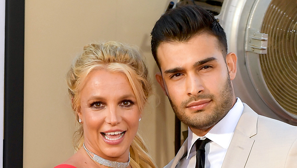 Britney Spears and Sam Asghari pose together at an event