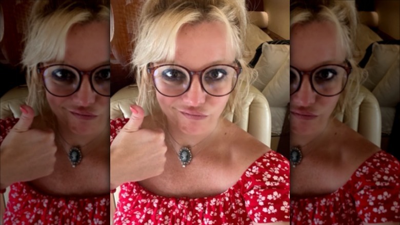 Britney giving a thumbs up to the camera