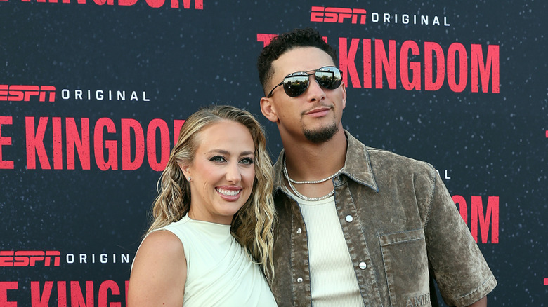 Brittany and Patrick Mahomes pose in 2025