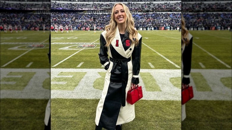 Brittany Mahomes smiling trenchcoat 