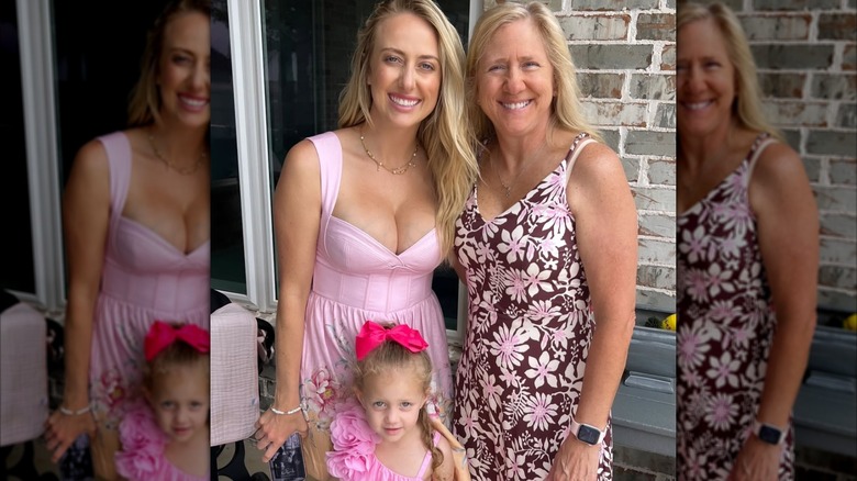 Brittany Mahomes wearing a revealing pink Easter dress while posing with her daughter and mom