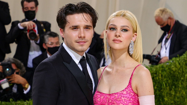 Brooklyn Beckham posing with Nicola Peltz