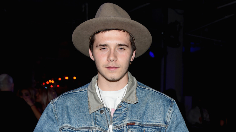 Brooklyn Beckham wearing hat